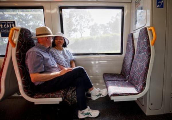 Reynolds and Ellis settle in for the cheap train ride to Brisbane.