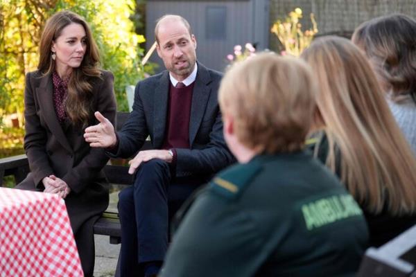 Britain's Prince William, Prince of Wales and Britain's Catherine, Princess of Wales speak to members of the emergency services during a visit to Southport Community Centre in Southport, north west England on October 10, 2024. (AFP)