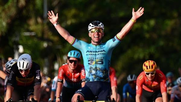 Mark Cavendish celebrates at the finish line as race winner ahead of (L-R) Biniam Girmay, Arnaud De Lie and Jasper Philipsen