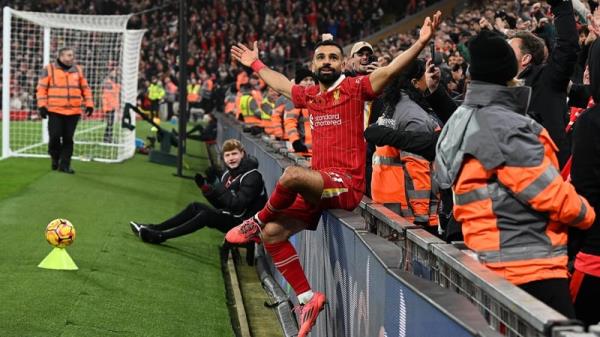 Mohamed Salah celebrates after scoring Liverpool's second goal